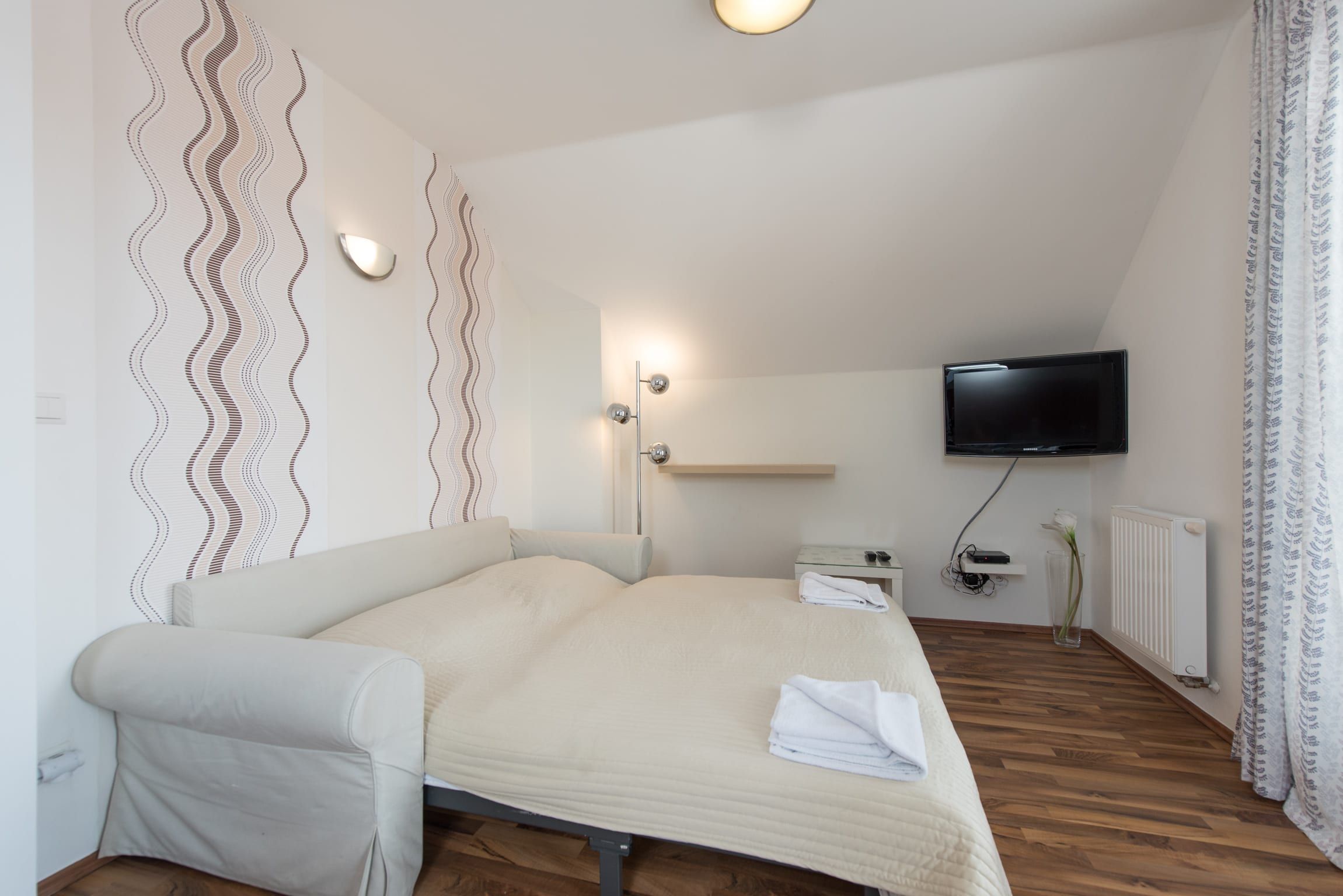 Ložnice v podkrovním apartmánu
